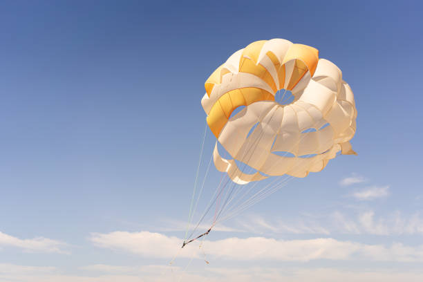 istock Soaring High in the Sky, A Parasailing Adventure on a Clear Day 2151896550