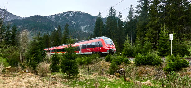 Biberwier, Austria, April 9, 2024: Red regional train on the route from Austria to Germany in Tyrol