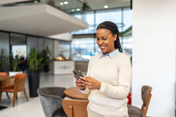 istock African-American businesswoman using cell phone 2151898685