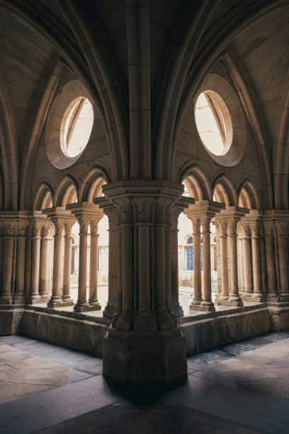 istock The inner courtyard of Porto Cathedral is bathed in a serene, diffuse light, casting soft shadows around the ornate architecture of the arches and columns 2151903054