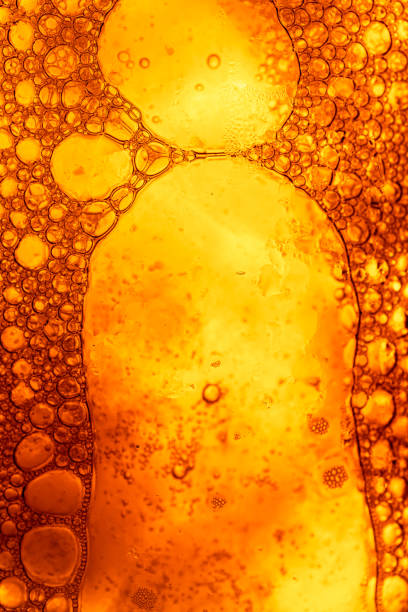istock Yellow drink bubble texture close-up,Beer Background Ice Cold Pint With Water Drops Condensation,Golden yellow water drops. Nature collection. 2151903451