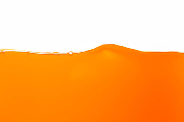 istock Orange juice texture, close-up, macro, isolated white background,Close up bright orange juice texture for health and nature waves 2151903467