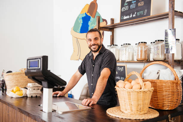 istock Storekeeper Standing Behind Counter in Zero Waste Eco-Friendly Grocery 2151903783