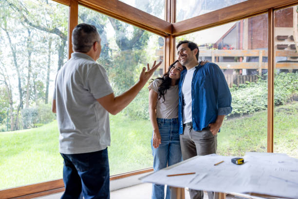 istock Building contractor renovating a house and talking to his clients 2151912552