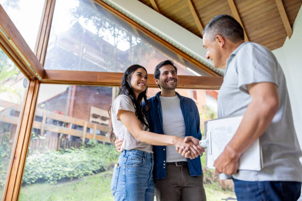 istock Building contractor greeting clients interested in remodeling 2151912554