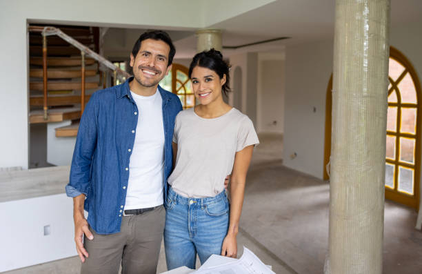 istock Couple remodeling their house and smiling 2151912573