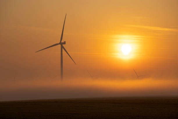 istock wind turbines at sunrise 2151913218