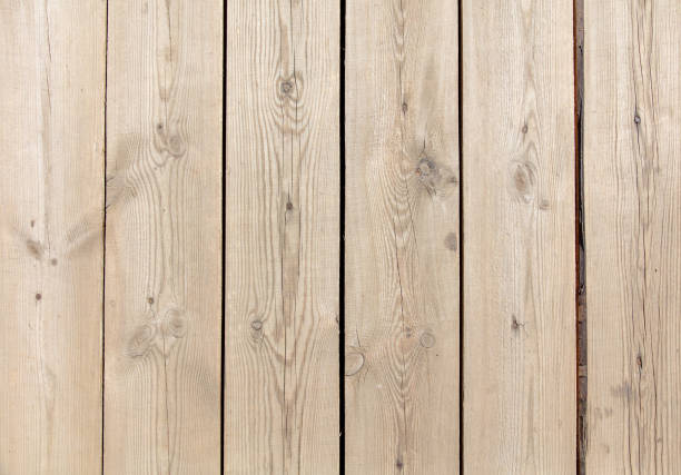 Old boards on a wooden fence as an abstract background.