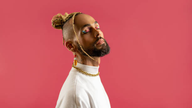 istock Black latin gay man isolated on pink background 2151917865