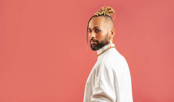 istock Black latin gay man isolated on pink background 2151917875