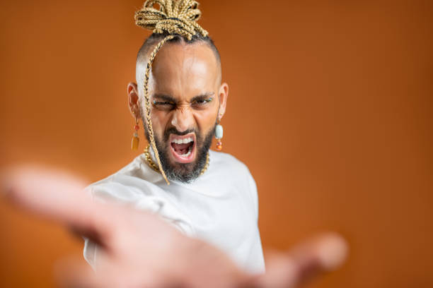 istock Black latin gay man outstretching empty hand towards camera 2151917880