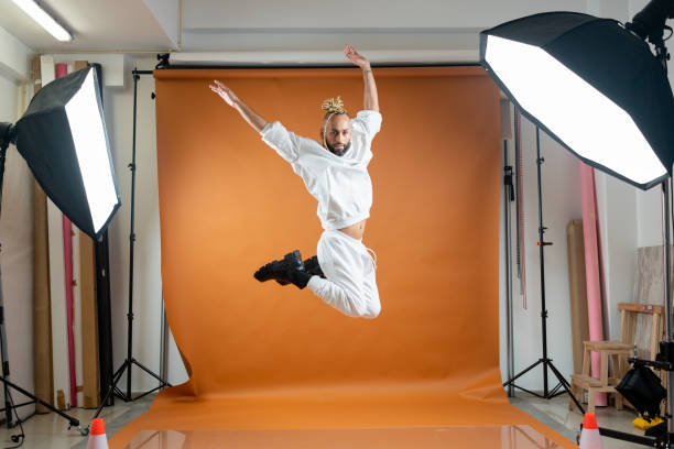 istock Gay man dancing in photo studio 2151917883