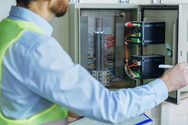 istock Electrical engineer man checking Power Distribution Cabinet in the control room 2151919089