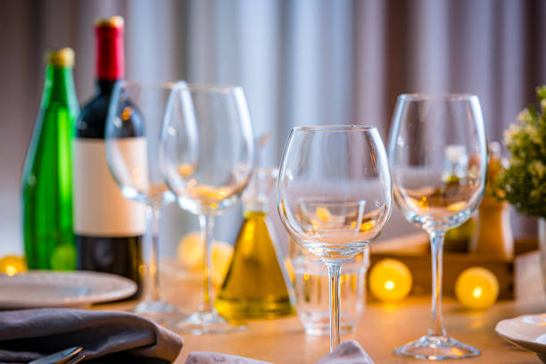 istock Wine glasses ready for a party on restaurant table with place setting 2151919376
