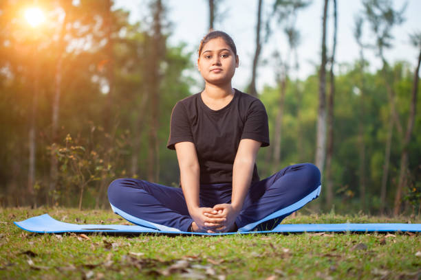istock indian women practicing Baddha Konasana, Bound Angle Pose, Butterfly Pose, or Cobbler's Pose, 2151919984