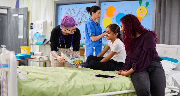 istock paediatrician showing young patient a leaflet 2151921157
