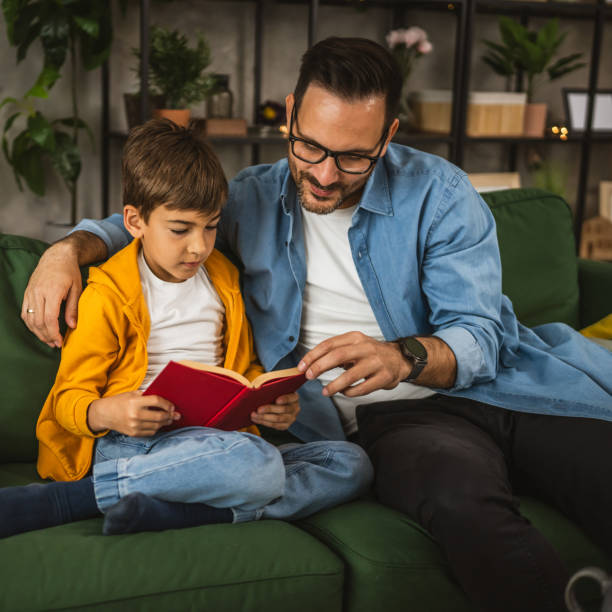 istock Father and son read a book and have fun while spend time together 2151925823