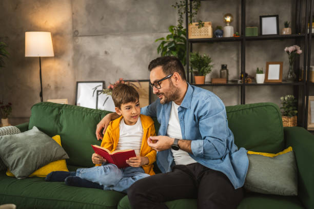 istock Father and son read a book and have fun while spend time together 2151925899