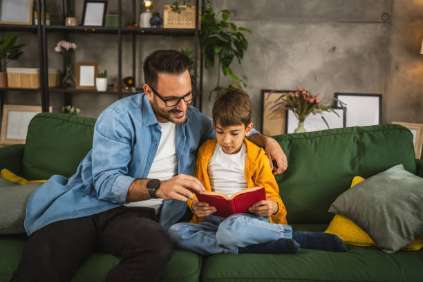 istock Father and son read a book and have fun while spend time together 2151925906