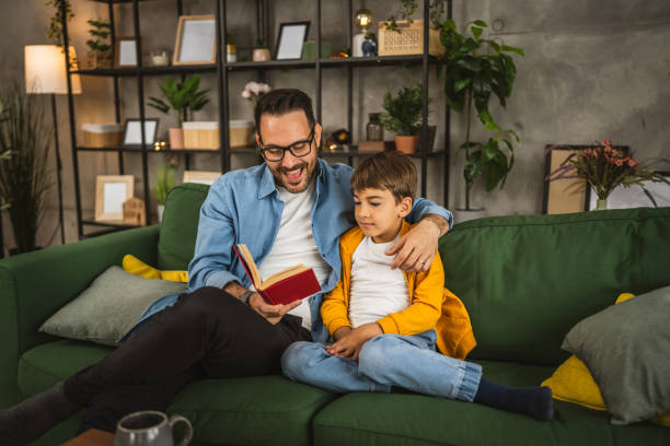 istock Father and son read a book and have fun while spend time together 2151925989