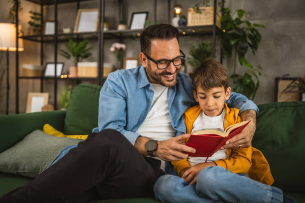 istock Father and son read a book and have fun while spend time together 2151926025