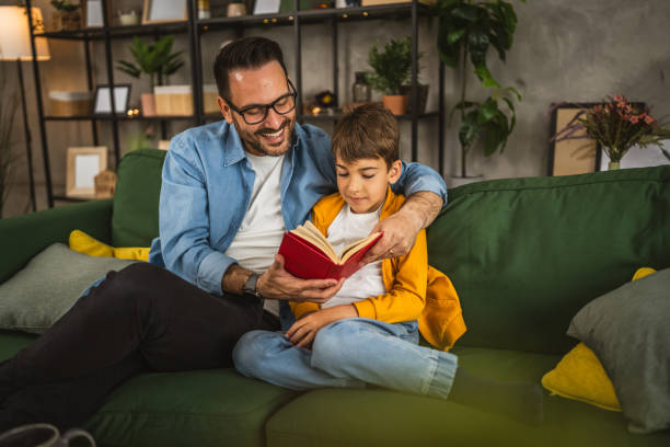 istock Father and son read a book and have fun while spend time together 2151926028