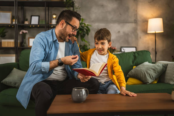 istock Father and son read a book and have fun while spend time together 2151926160