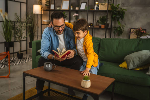 istock Father and son read a book and have fun while spend time together 2151926959