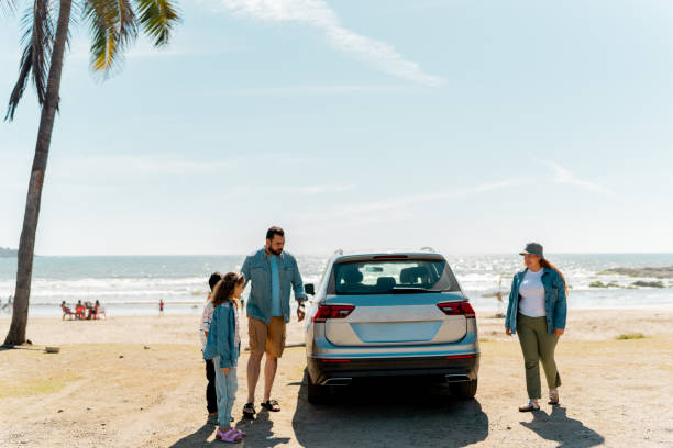 istock Family arriving on the beach 2151927187