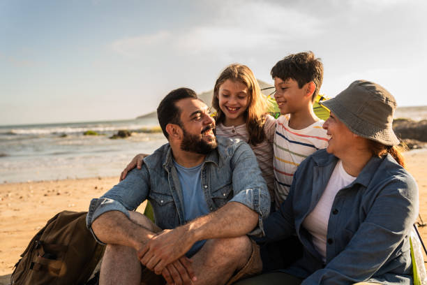 istock Family talking and camping on the beach 2151928989