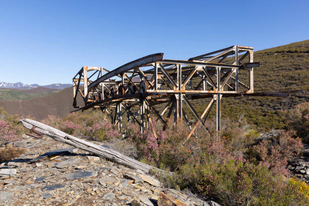 istock Metal structure tower with concrete base from coal mine cable cart industrial abandoned cableway on a spring sunny 2151929712