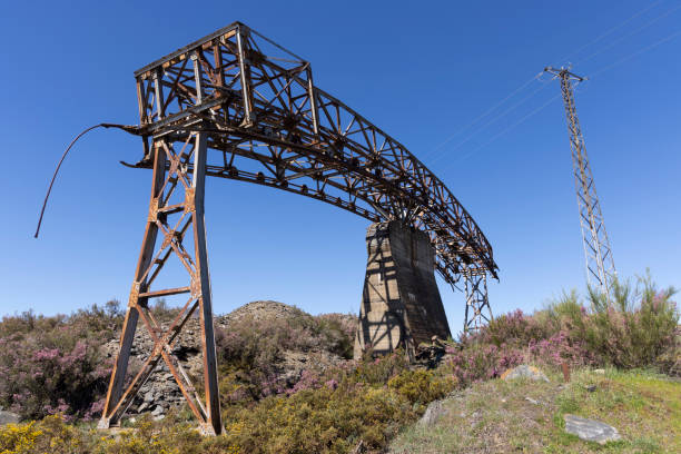 istock Metal structure tower with concrete base from coal mine cable cart industrial abandoned cableway on a spring sunny 2151929756