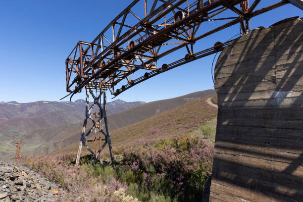 istock Metal structure tower with concrete base from coal mine cable cart industrial abandoned cableway on a spring sunny 2151929781
