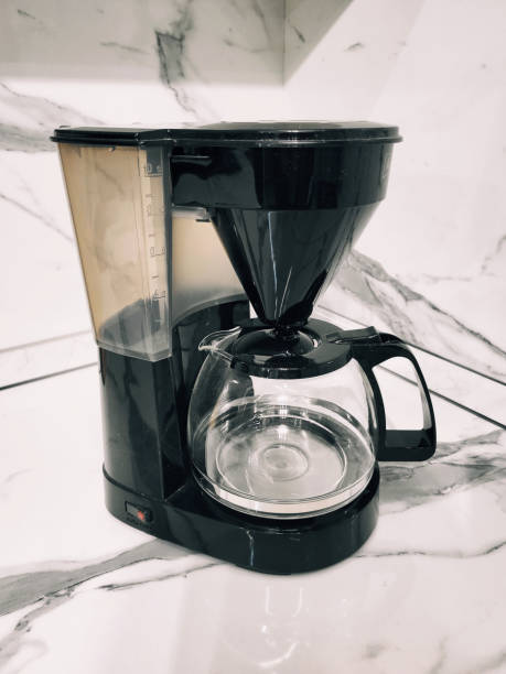 istock Black coffee maker on a wooden stand 2151929966