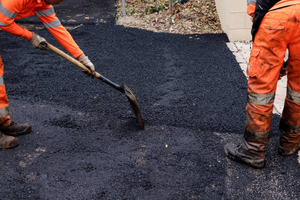 istock Renewing the City: Team of Workers Repaving Urban Streets 2151930123