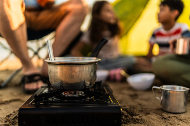 Close-up of cooking pan on sand