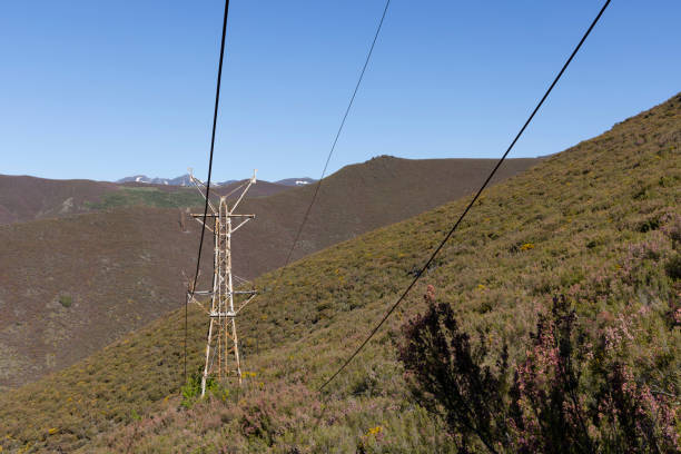 istock Abandoned industrial coal mining steel structure tower from cableway with cable in Tormaleo Asturias province of Spain on a bright day. 2151930403