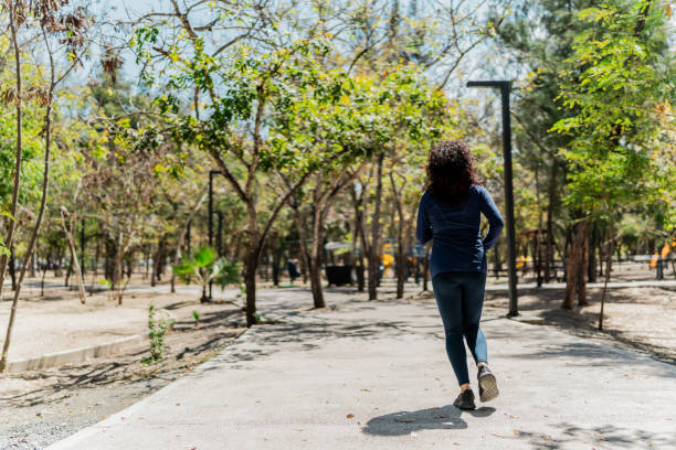 istock Young woman running on the public park 2151931795