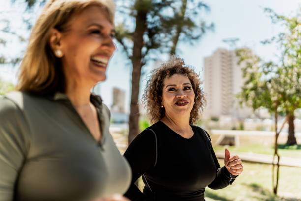 istock Senior women talking and running through the public park 2151932916