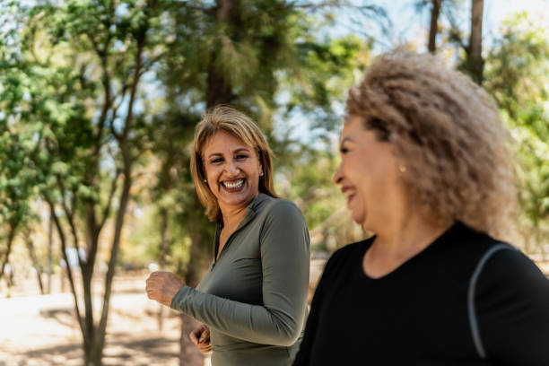 istock Senior women talking and running through the public park 2151932919