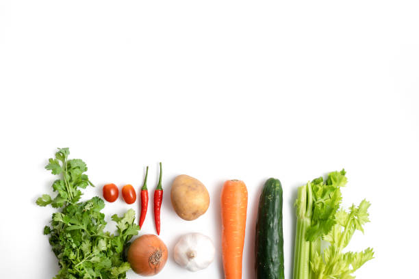 Top view flat lay of assorted tropical fresh vegetables with copy space, embodying the concept of healthy eating