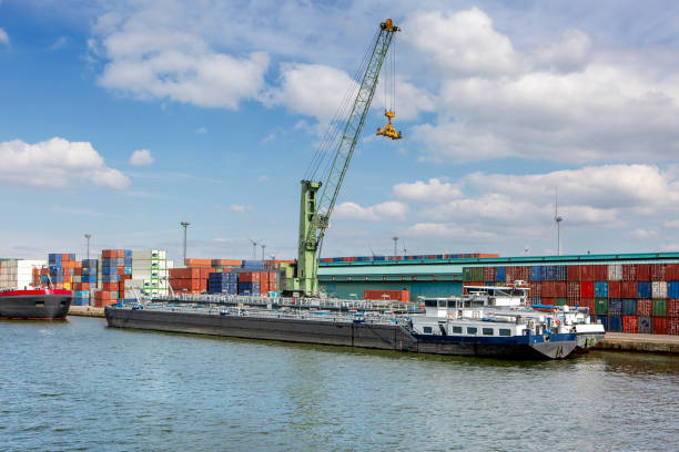 istock Large gantry crane and container ship - port of Antwerp 2151935416