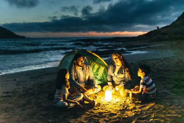 istock Family talking and camping on the beach 2151935900