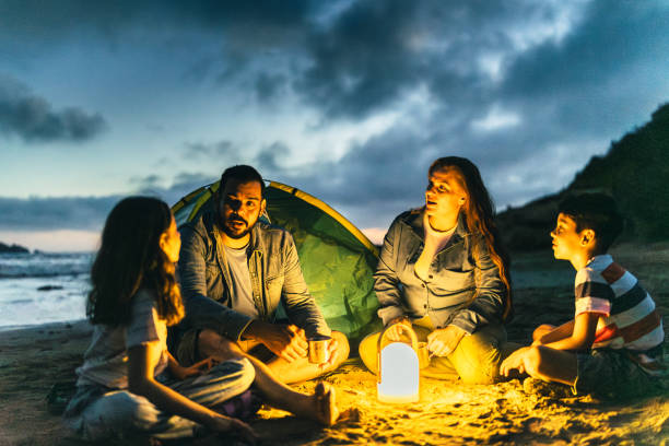 istock Family talking and camping on the beach 2151935903
