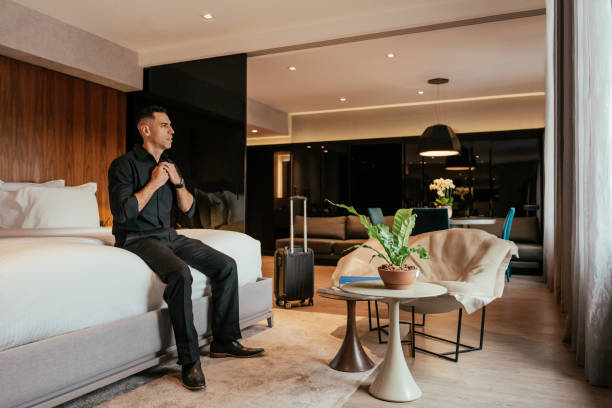 istock Businessman arriving at hotel room 2151935976