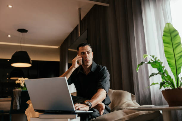istock Businessman working in hotel room 2151936107