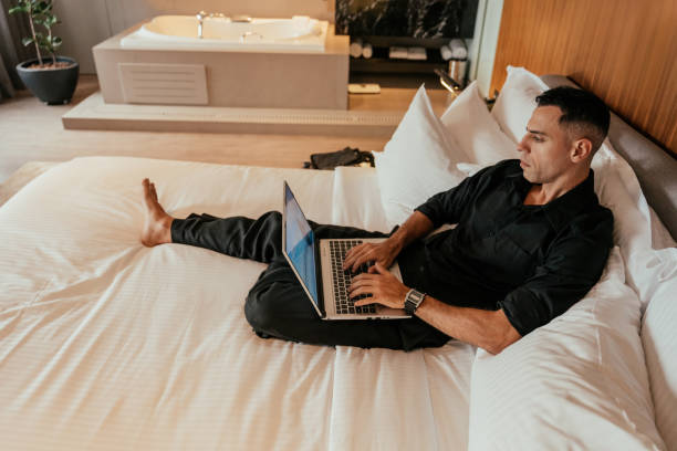 istock Businessman working in hotel room 2151936283
