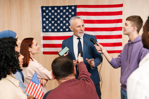 istock Senior presidential candidate giving an interview to journalists while standing at polling station 2151937229