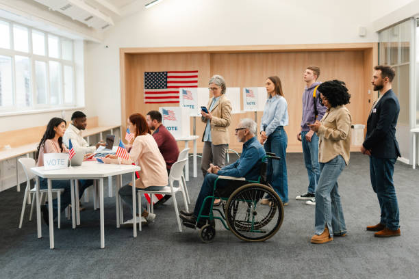 istock Group of diverse US citizens performing civic responsibility waiting in line 2151940202