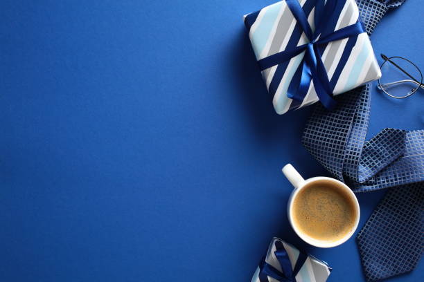 istock Happy Fathers Day concept. Flat lay retro gift boxes, coffee cup, tie, glasses on dark blue background. 2151941080